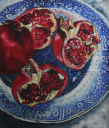 Pomegranates on blue plate